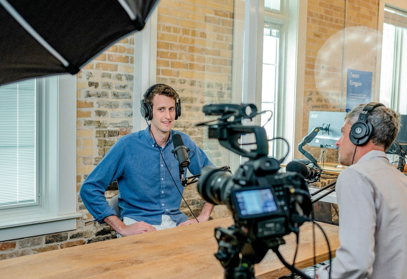 Interview set with cinema camera and softbox overlooking a city
